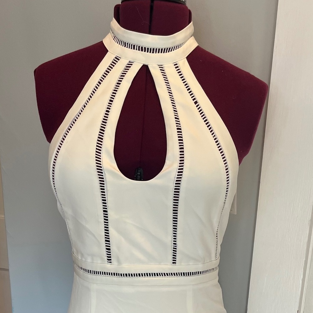 Sexy white Bardot dress with cut out details.